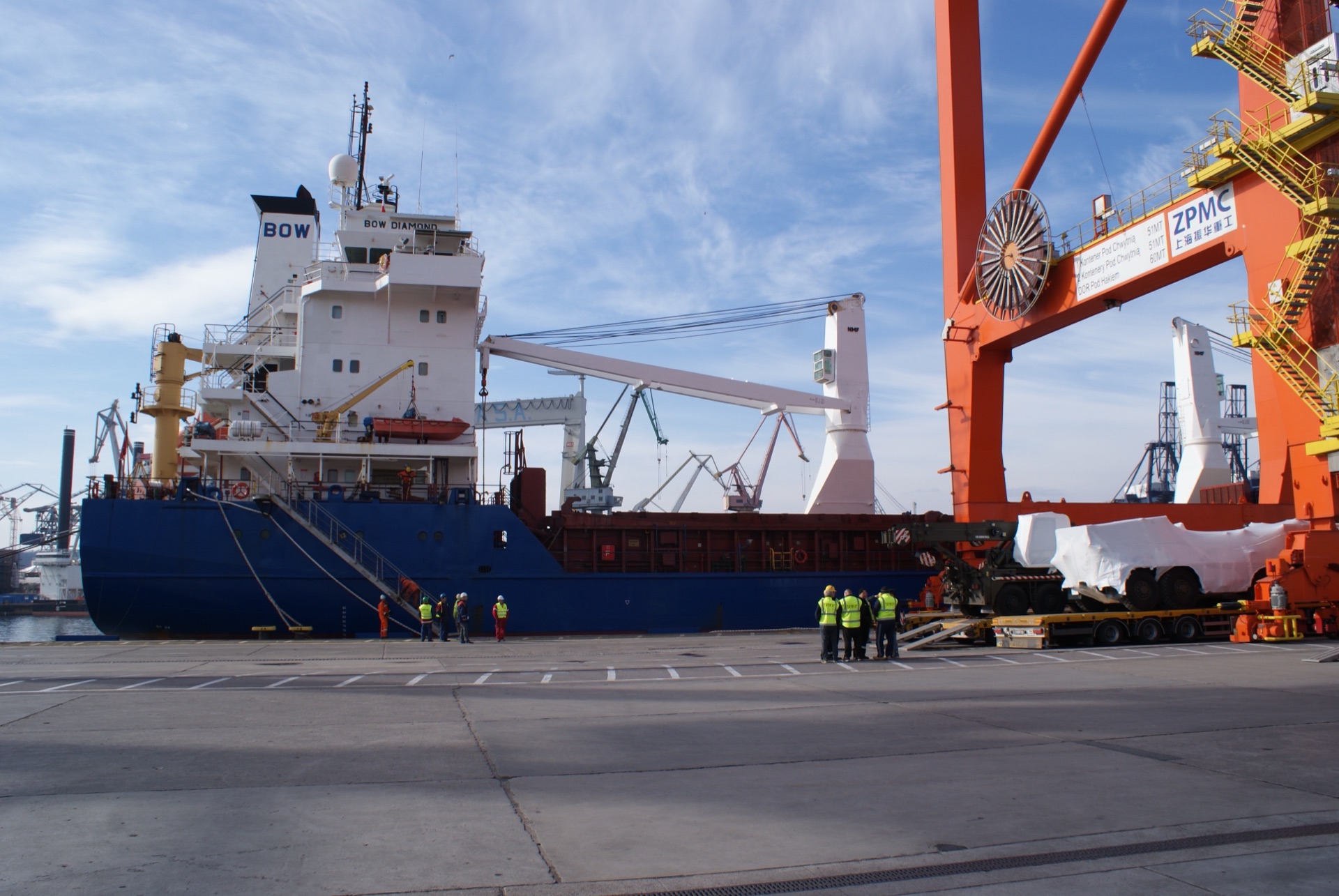 Cargo vessel at port with oversized freight